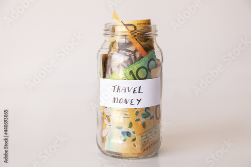 21 money jar full of australian notes for holiday trip photo