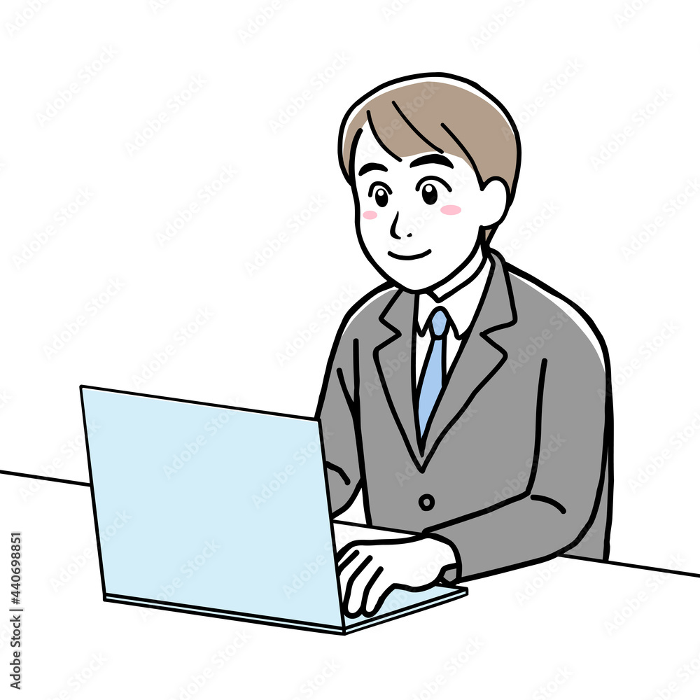 A young man in suit using his laptop