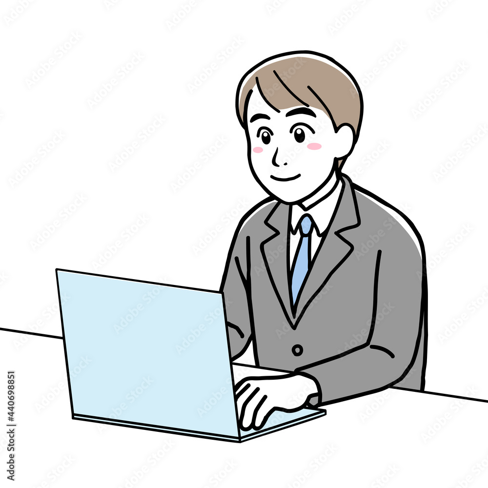 A young man in suit using his laptop A young man in suit using his laptop