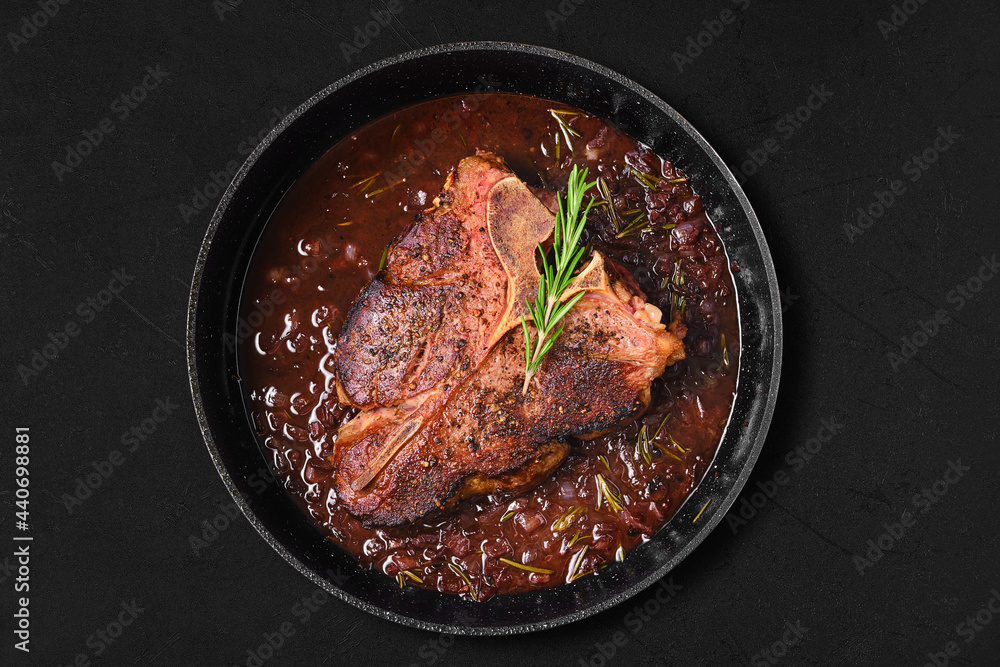 Overhead view of Porterhouse steak in wine sauce Overhead view of Porterhouse steak in wine sauce