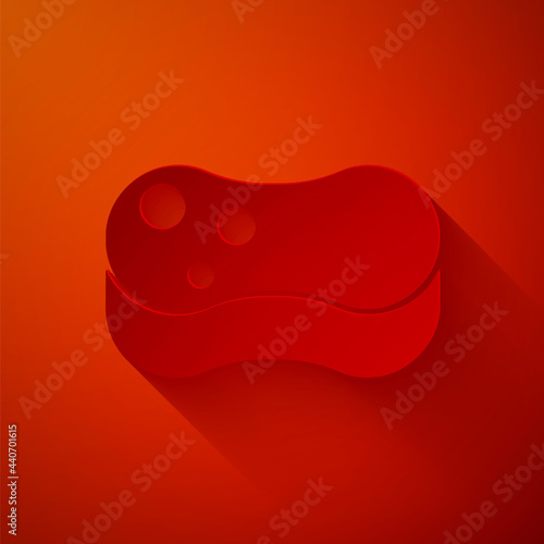 Paper cut Sponge icon isolated on red background. Wisp of bast for washing dishes. Cleaning service concept. Paper art style. Vector Illustration