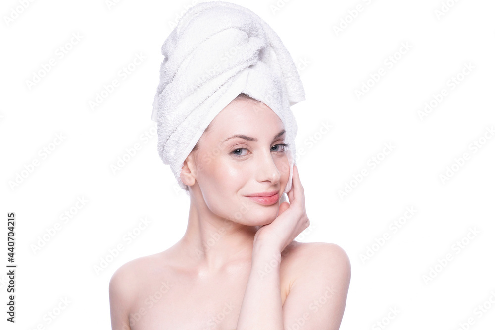 Beautiful attractive blond young woman with clean fresh soft skin applying cream with white background. Beauty care face treatment. Natural studio healthy cosmetic portrait. Cosmetology, beauty, spa Beautiful attractive blond young woman with clean fresh soft skin applying cream with white background. Beauty care face treatment. Natural studio healthy cosmetic portrait. Cosmetology, beauty, spa