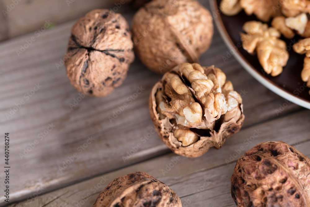 A plate of walnuts and some walnuts