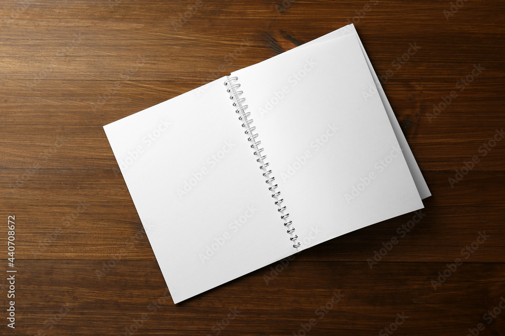 Blank paper brochure on wooden table, top view. Mockup for design Blank paper brochure on wooden table, top view. Mockup for design