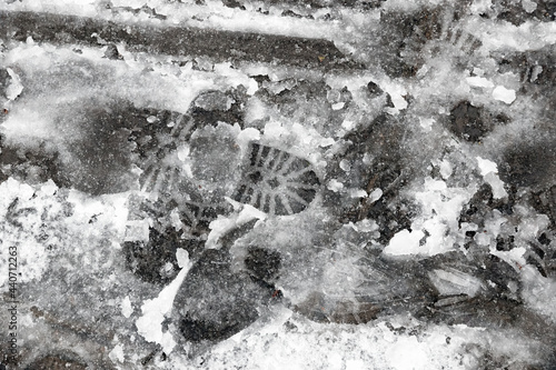 Konstfotografi Footprints on melting slushy snow on London street