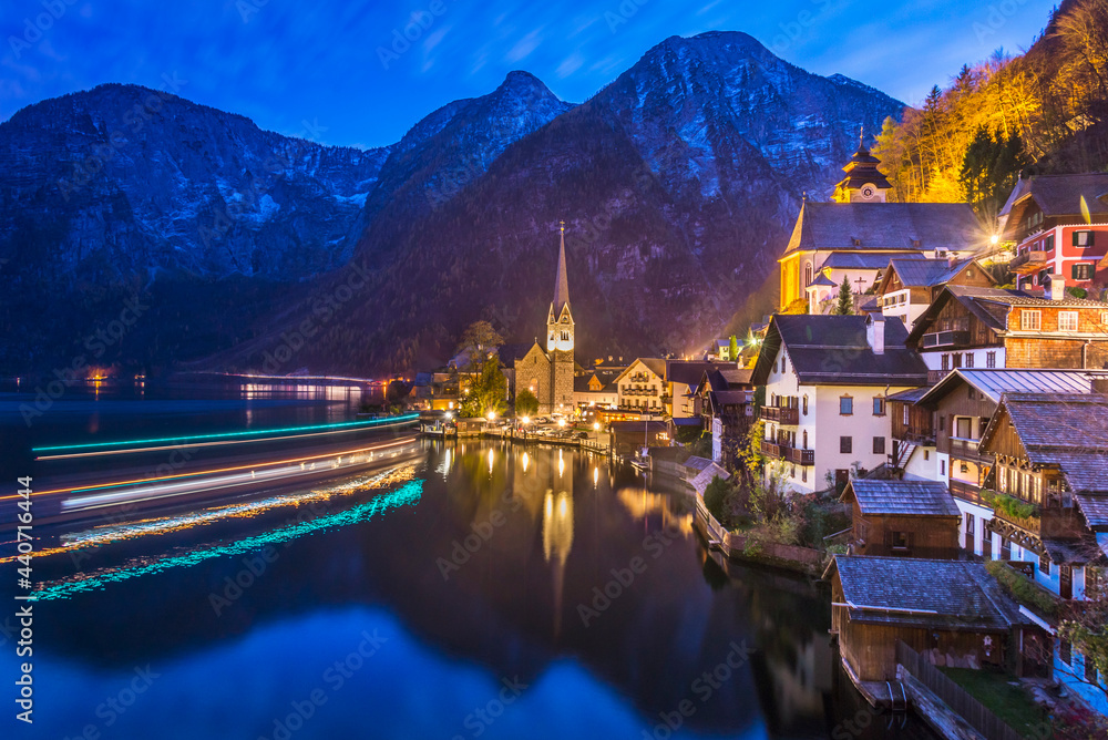 Ferry comes into dock at Hallstatt on an autumn evening.