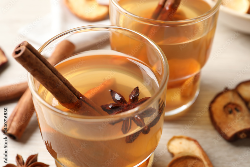 Delicious compote with anise and cinnamon on white table, closeup Delicious compote with anise and cinnamon on white table, closeup