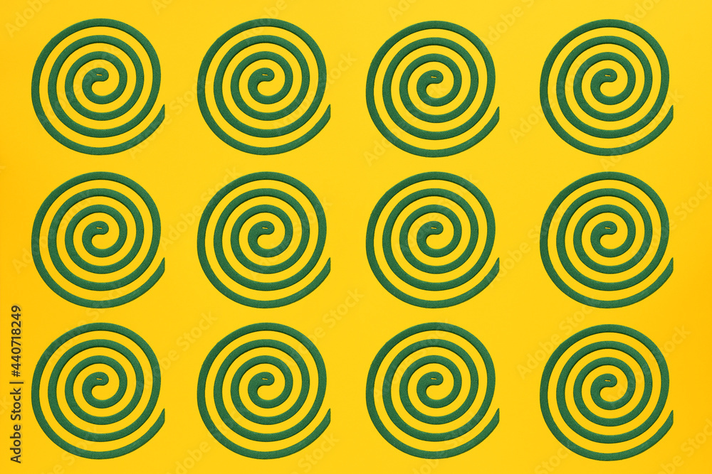 Green mosquito coils on yellow background. Green mosquito coils on yellow background.