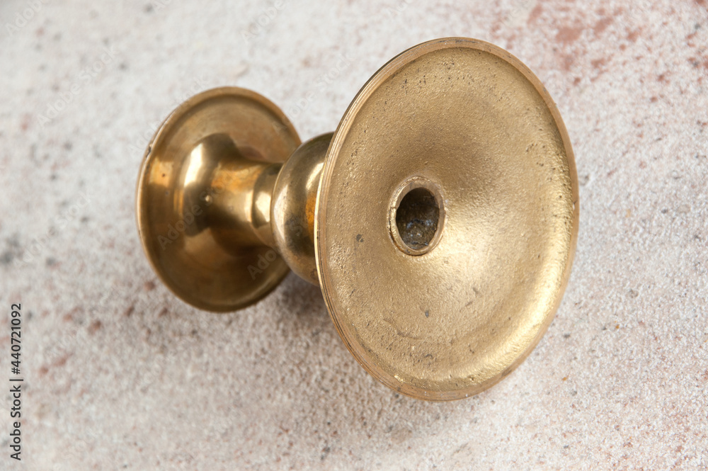 Antique candlestick on concrete background Antique candlestick on concrete background