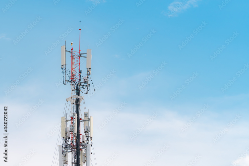 Telecommunication tower with blue sky and white clouds background. Antenna on blue sky. Radio and satellite pole. Communication technology. Telecommunication industry. Mobile or telecom 4g network. Telecommunication tower with blue sky and white clouds background. Antenna on blue sky. Radio and satellite pole. Communication technology. Telecommunication industry. Mobile or telecom 4g network.