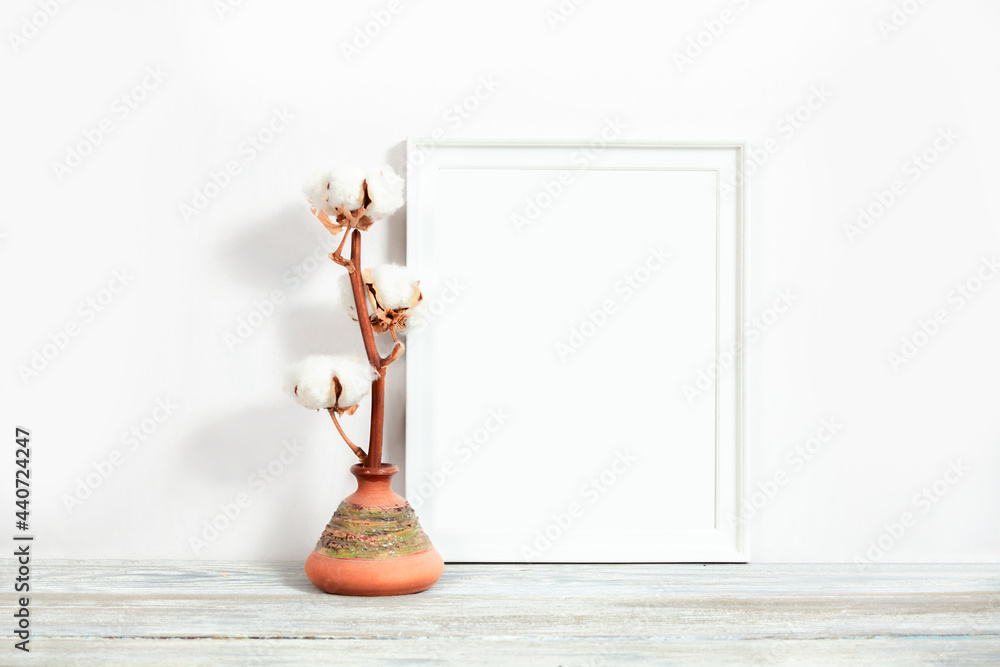 White frame 8x10 with a sprig of cotton