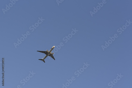 Airplane in the sky. Clear  cloudless sky. Air travel.