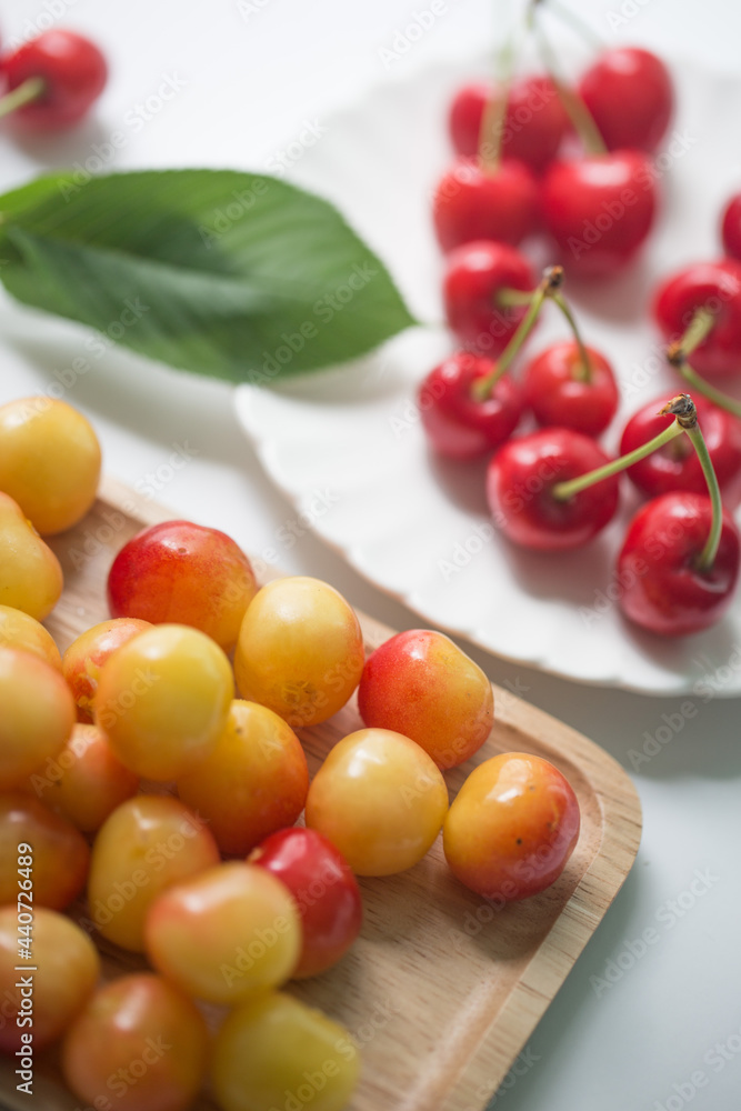 Fresh cherries with cherry leaf isolated on a white background. Fresh cherries with cherry leaf isolated on a white background.