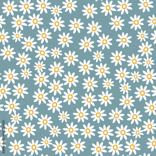 Cute floral seamless pattern with small chamomile on blue background. Modern elegant fashion print. Vector illustration