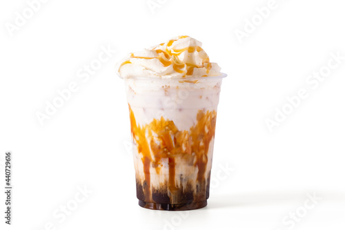 caramel macchiato coffee with caramel and whipping cream in glass Isolate on white background. cafe menu concept.