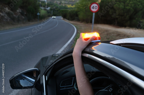 Emergency light for damaged vehicles (luminous beacon V16) .help flash, dgt, mandatory to replace by triangles. photo