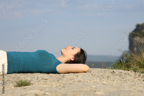 Mixed race woman lying resting in the mountain