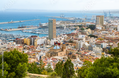 Alicante old town with narrow streets, ancient houses, port with yachts and Cathedral. Historic neighborhood Casco Antiguo Santa Cruz. Costa Blanca region in Spain.