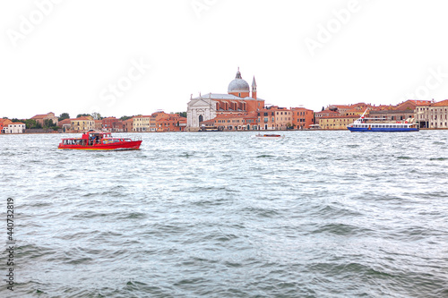 View of Giudecca island in Venice Italy . Overlooking an island in the Venetian Lagoon . Boat tour on Grand Canal . Le Zitelle church