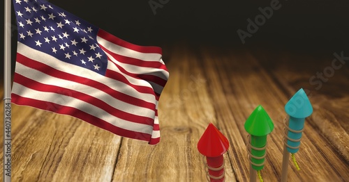 Fototapeta Naklejka Na Ścianę i Meble -  Composition of american flag and fireworks over wooden table