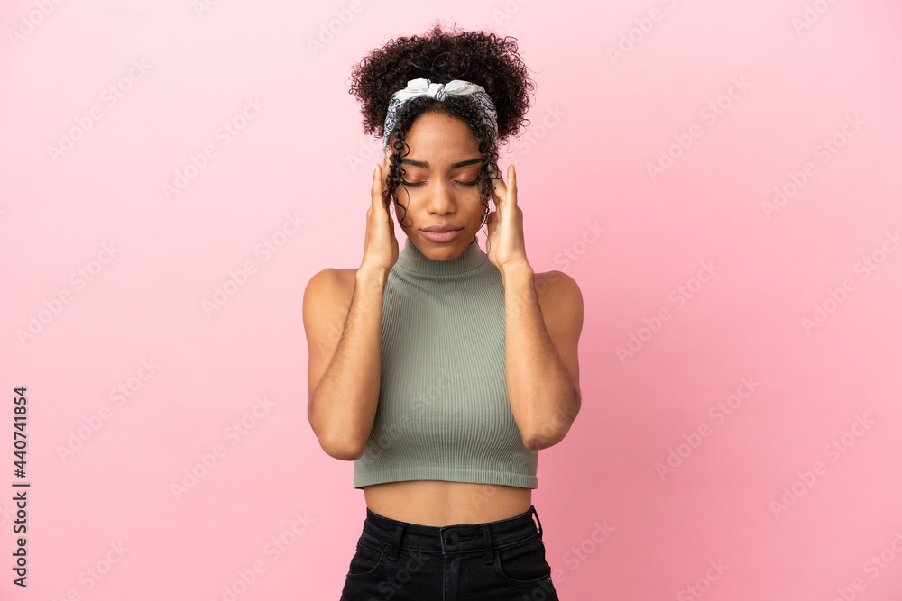 Young latin woman isolated on pink background with headache Young latin woman isolated on pink background with headache