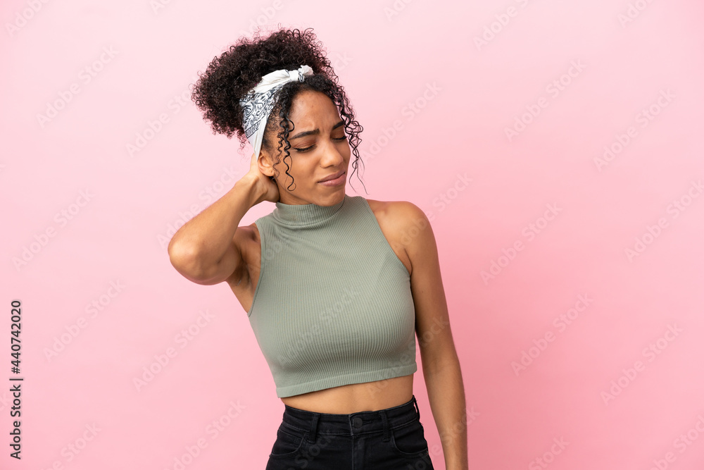Young latin woman isolated on pink background with neckache Young latin woman isolated on pink background with neckache