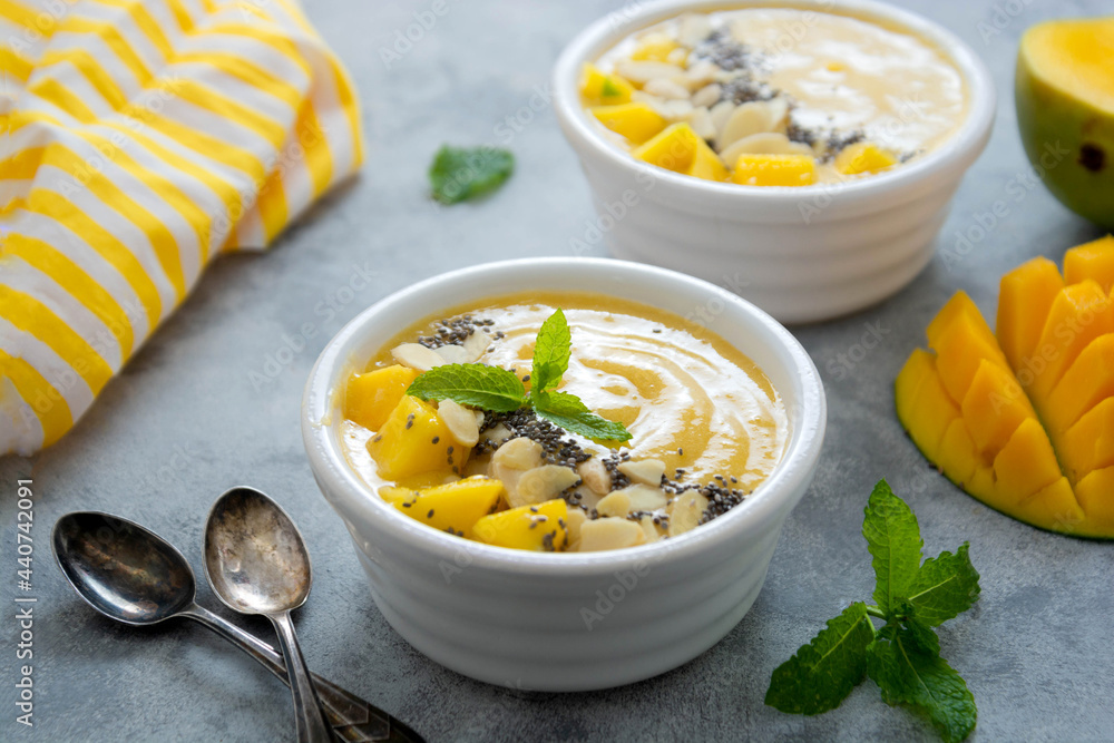 Mango smoothie bowl with chia seeds. Clean eating concept Mango smoothie bowl with chia seeds. Clean eating concept
