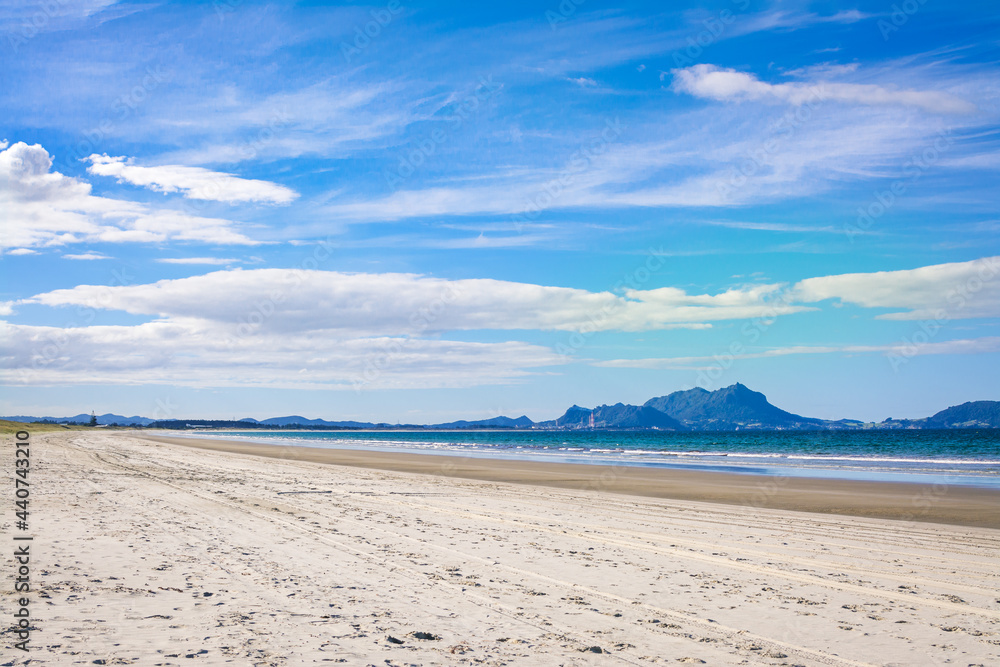 Wide streak of white sandy beach on a bright autumn day Wide streak of white sandy beach on a bright autumn day