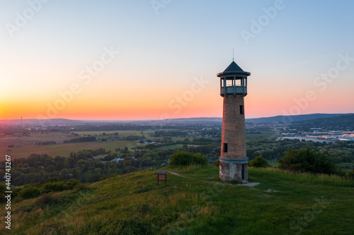 Beautiful aerial sunset landscape about Strazsa Hill with lookout tower which is located near Esztergom, in the Pilis Mountains. Dorog city at the background.