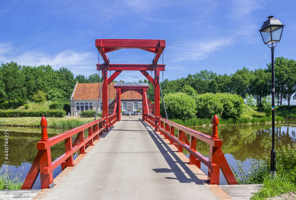 Red wooden bridge leading to the historic town of Bourtange Red wooden bridge leading to the historic town of Bourtange