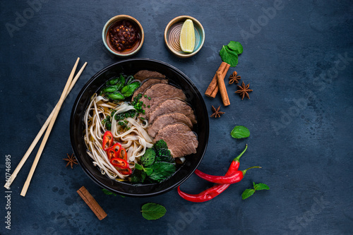 Pho bo, Vietnamese food, rice noodle soup with sliced beef photo