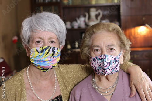 Senior ladies wearing colorful and fun protective masks
