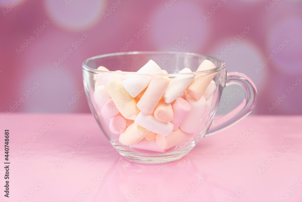 Marshmallows in a mug On a bright pink background Marshmallows in a mug On a bright pink background