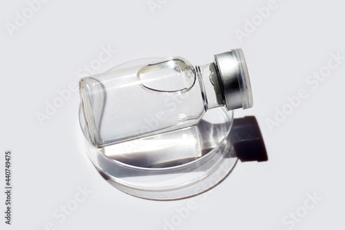 Bottle of vaccine on white background.