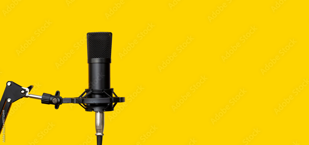 Studio microphone on yellow background. Studio microphone on yellow background.