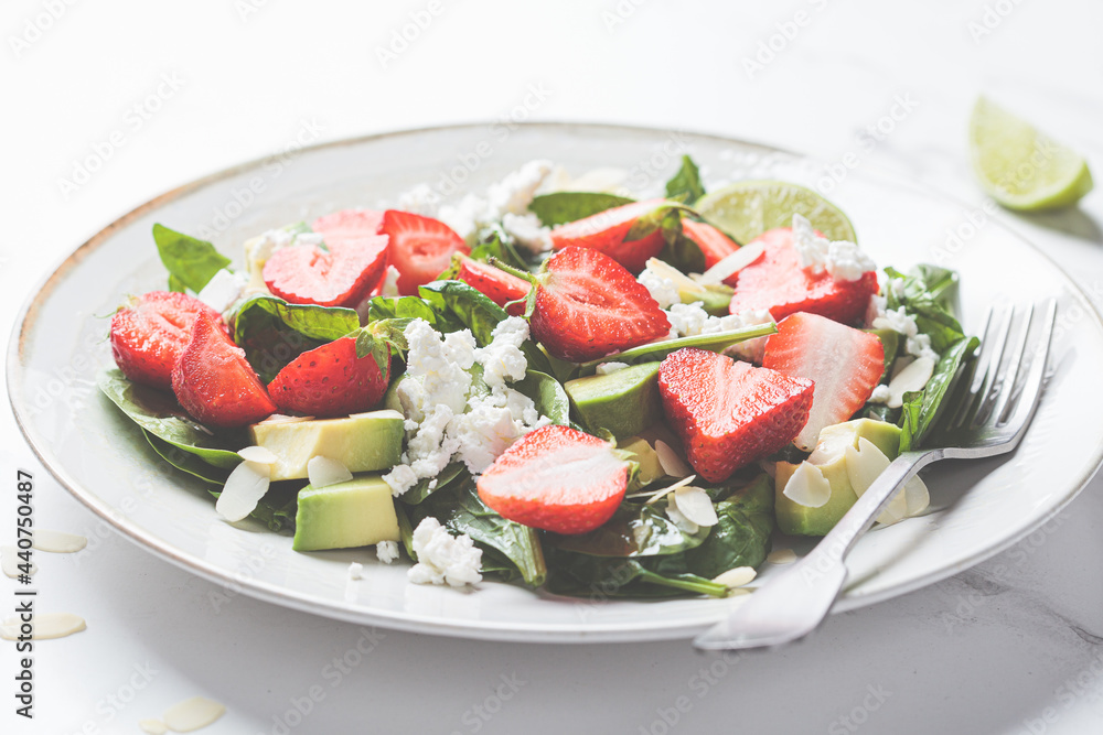 Strawberry salad with spinach, feta cheese, avocado and almonds. Strawberry salad with spinach, feta cheese, avocado and almonds.