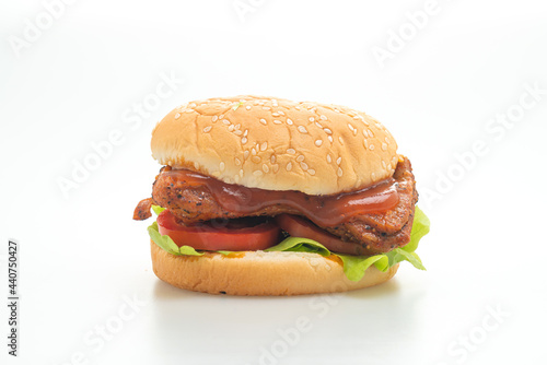 grilled chicken burger with sauce on white background