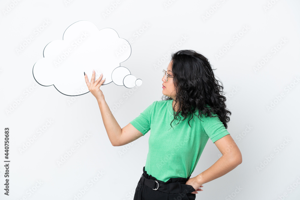 Young asian woman isolated on white background holding a thinking speech bubble Young asian woman isolated on white background holding a thinking speech bubble