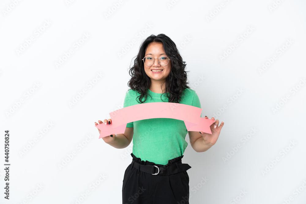 Young asian woman isolated on white background holding an empty placard Young asian woman isolated on white background holding an empty placard