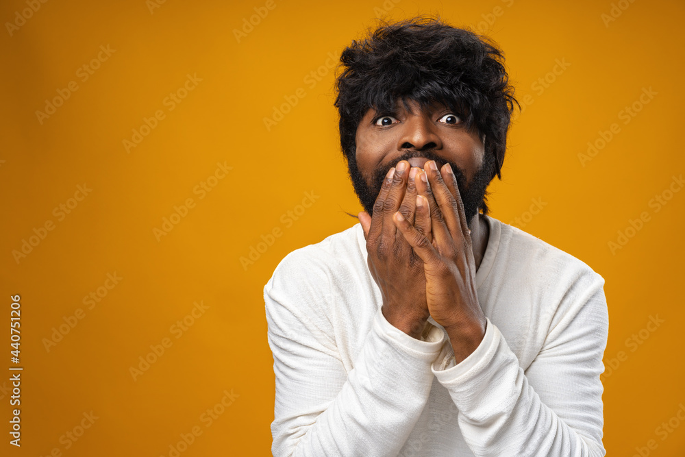Young african american man looking surprised with open mouth Young african american man looking surprised with open mouth