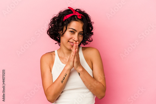 Young curly latin woman isolated on pink background feeling energetic and comfortable, rubbing hands confident.