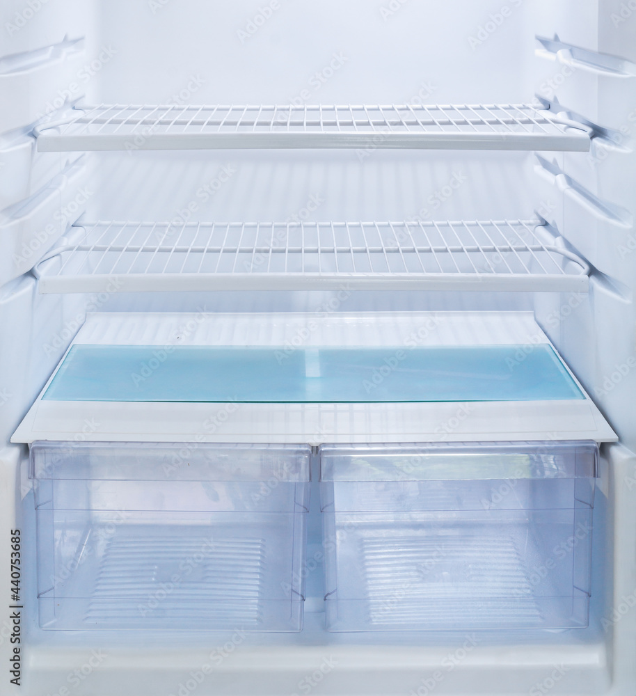 Empty refrigerator and vegetable bins. Empty refrigerator and vegetable bins.
