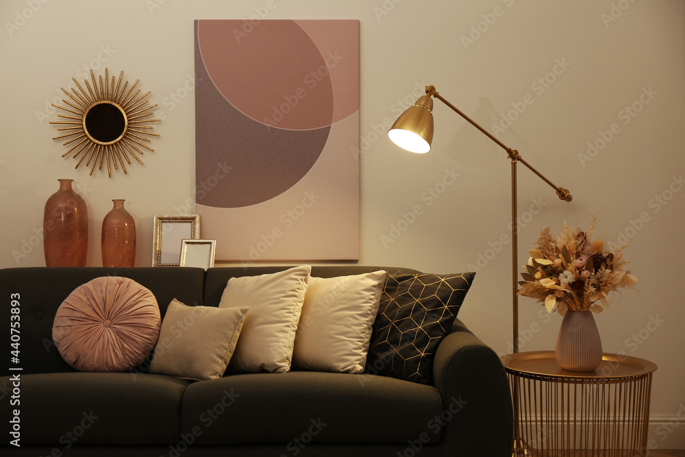 Stylish living room interior with comfortable sofa and floor lamp Stock ...