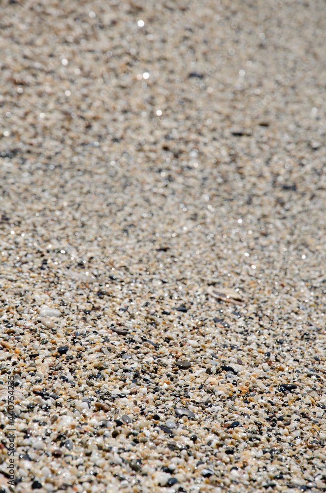 Natural background concept. Surface of the rocky beach. Pebble texture. Sea stones of various sizes cover the seaside. Selective focus multi-colored pebbles on the seashore. Natural background concept. Surface of the rocky beach. Pebble texture. Sea stones of various sizes cover the seaside. Selective focus multi-colored pebbles on the seashore.