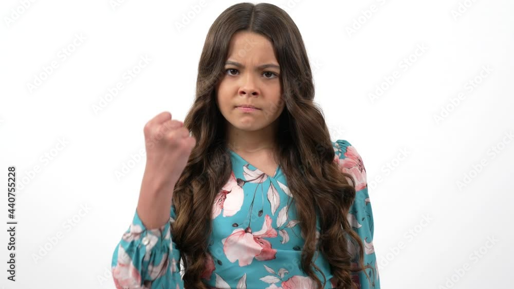 angry aggressive child threaten with fist physical attack, aggression and anger angry aggressive child threaten with fist physical attack, aggression and anger