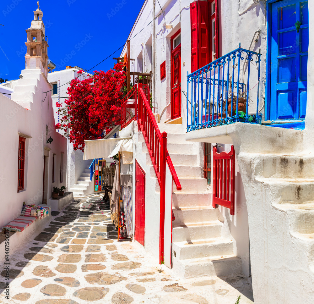 Authentic traditional Greece. Charming colorful floral streets of Mykonos island. Cyclades - obrazy, fototapety, plakaty 