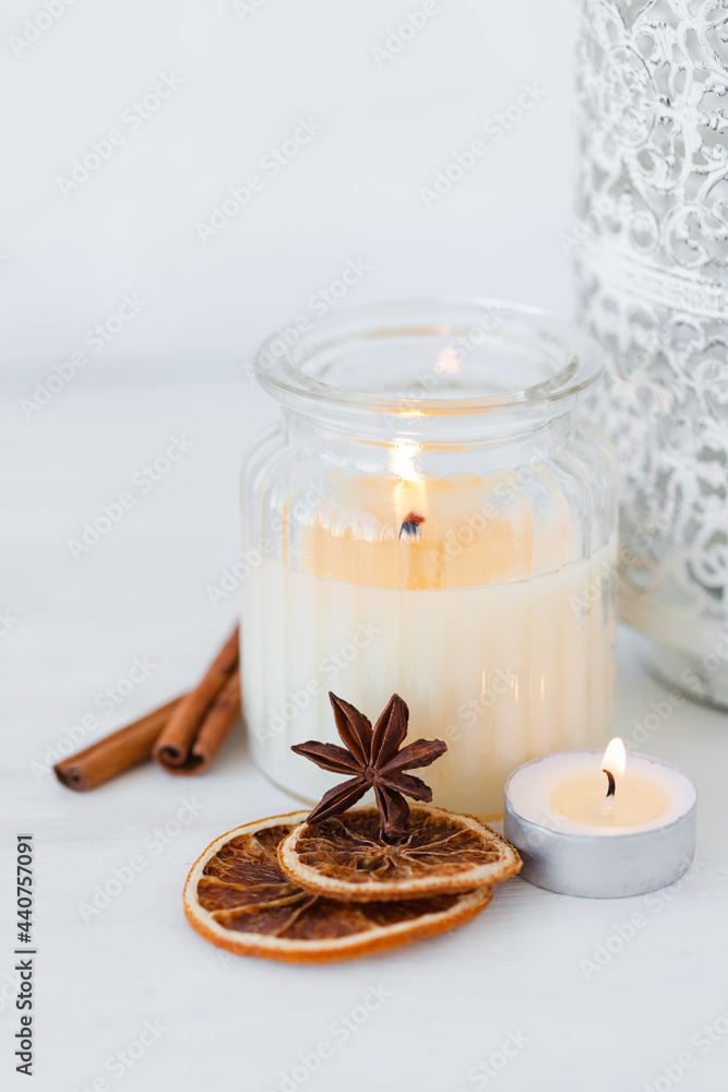 Assortment of natural christmas essential oils in small bottles. Candles, branches of fir tree. Aromatherapy, cozy home atmosphere, holiday festive mood. Close up macro, wooden background. Zero waste Assortment of natural christmas essential oils in small bottles. Candles, branches of fir tree. Aromatherapy, cozy home atmosphere, holiday festive mood. Close up macro, wooden background. Zero waste