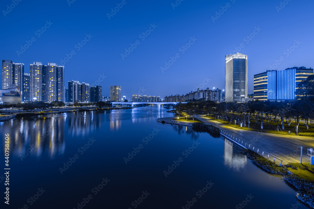 Night view of buildings on the bank of the Jiaomen River in Nansha District, Guangzhou