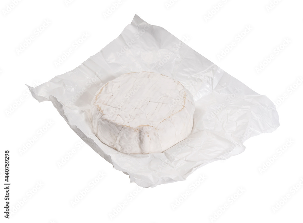 camembert cheese on white wrapping paper on white background