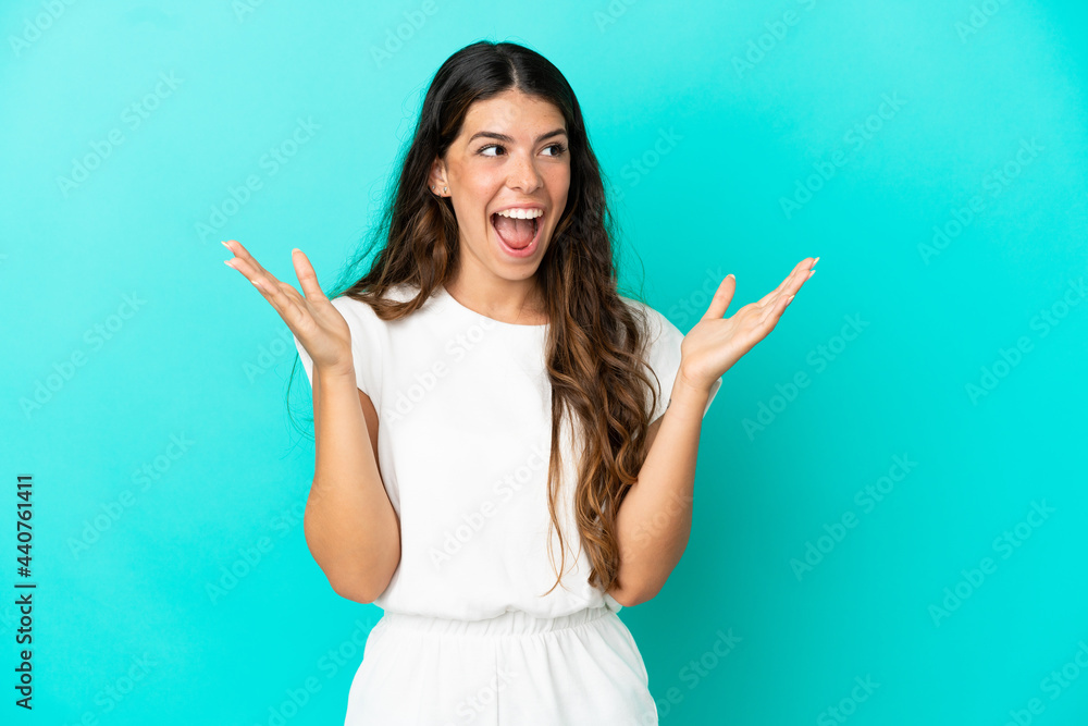 Young caucasian woman isolated on blue background with surprise facial expression Young caucasian woman isolated on blue background with surprise facial expression